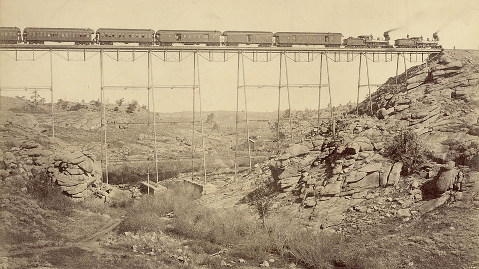 A train chugs across the spider-like and spindly looking Dale Creek bridge. When the Wyoming winds were blowing, it was especially terrifying to cross.