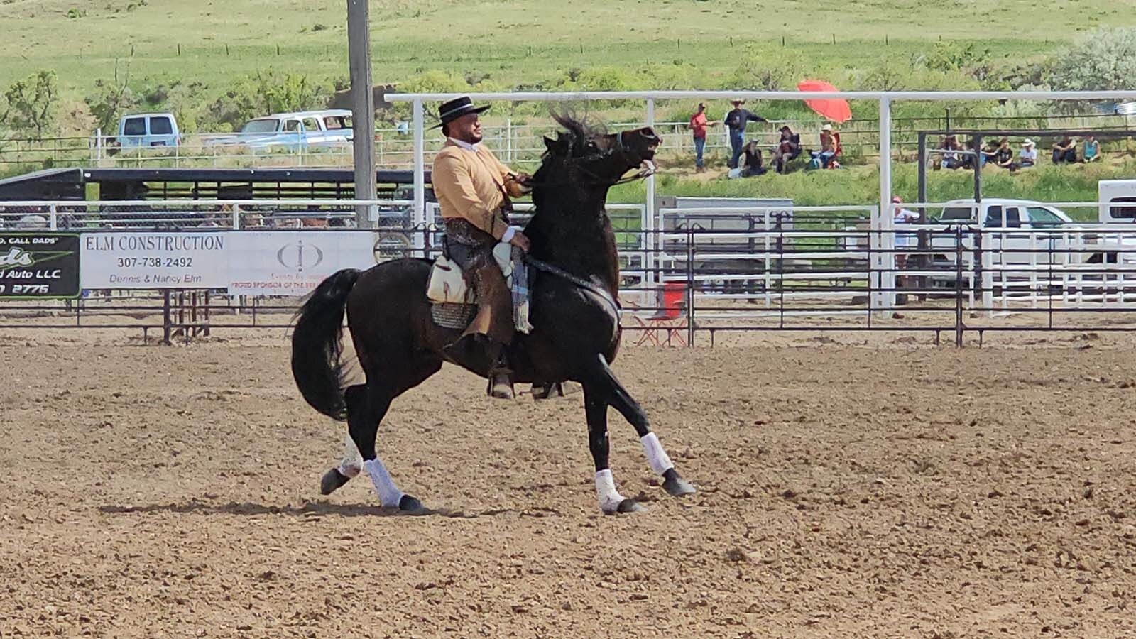 Felix Santana and his Andalusian horse Romano performed dance steps inspired by ancient war maneuvers during the rodeo at the final Chris LeDoux Days in Kaycee.