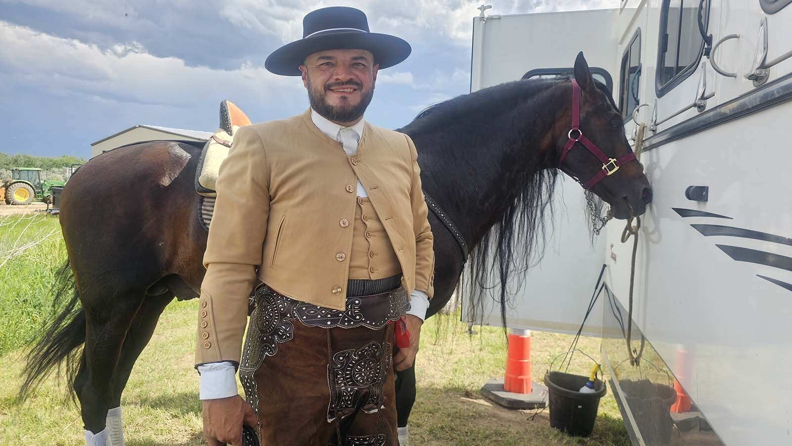 Felix Santana talks about his Andalusian horse Romano after a performance during the final Chris LeDoux Days rodeo.