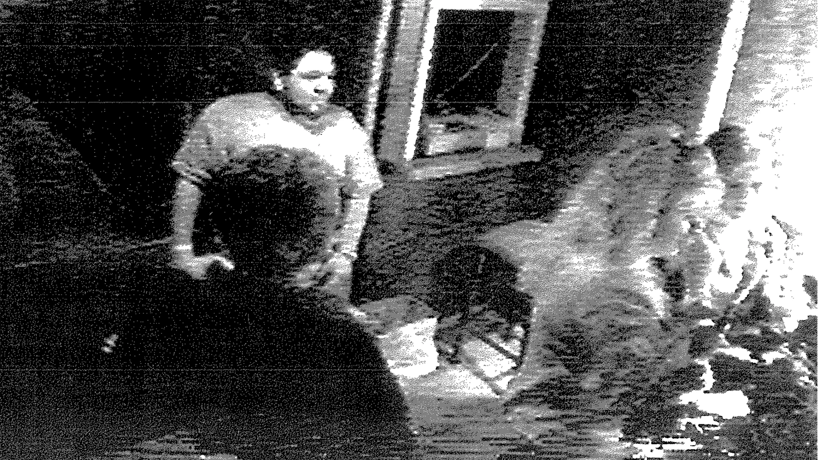 Two men were spotted leaving the Cattleman’s Club at around 12:45 a.m. on Oct. 20, 2001. Authorities were never able to track down the men with one pictured in this grainy image.
