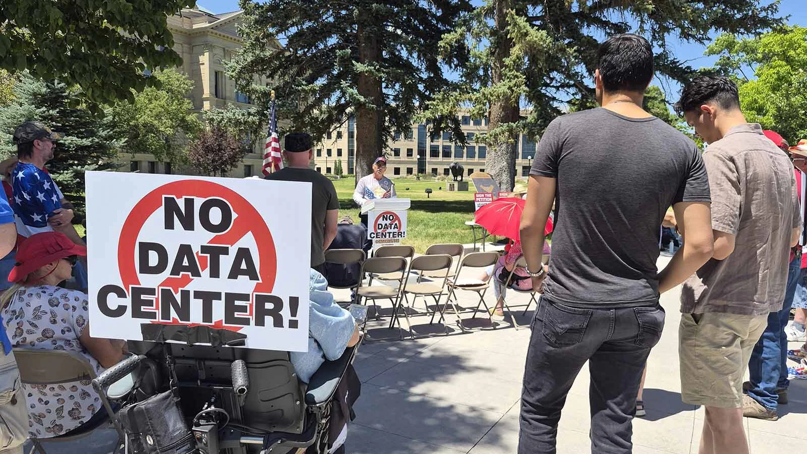 A small group of a few dozen people railed against existing and proposed data centers at the Wyoming Capitol on Saturday. “Anytime you scream ‘wolf,’ there actually is a wolf coming. It’s data centers,” said organizer Taylor Haynes. "It’s our government.”