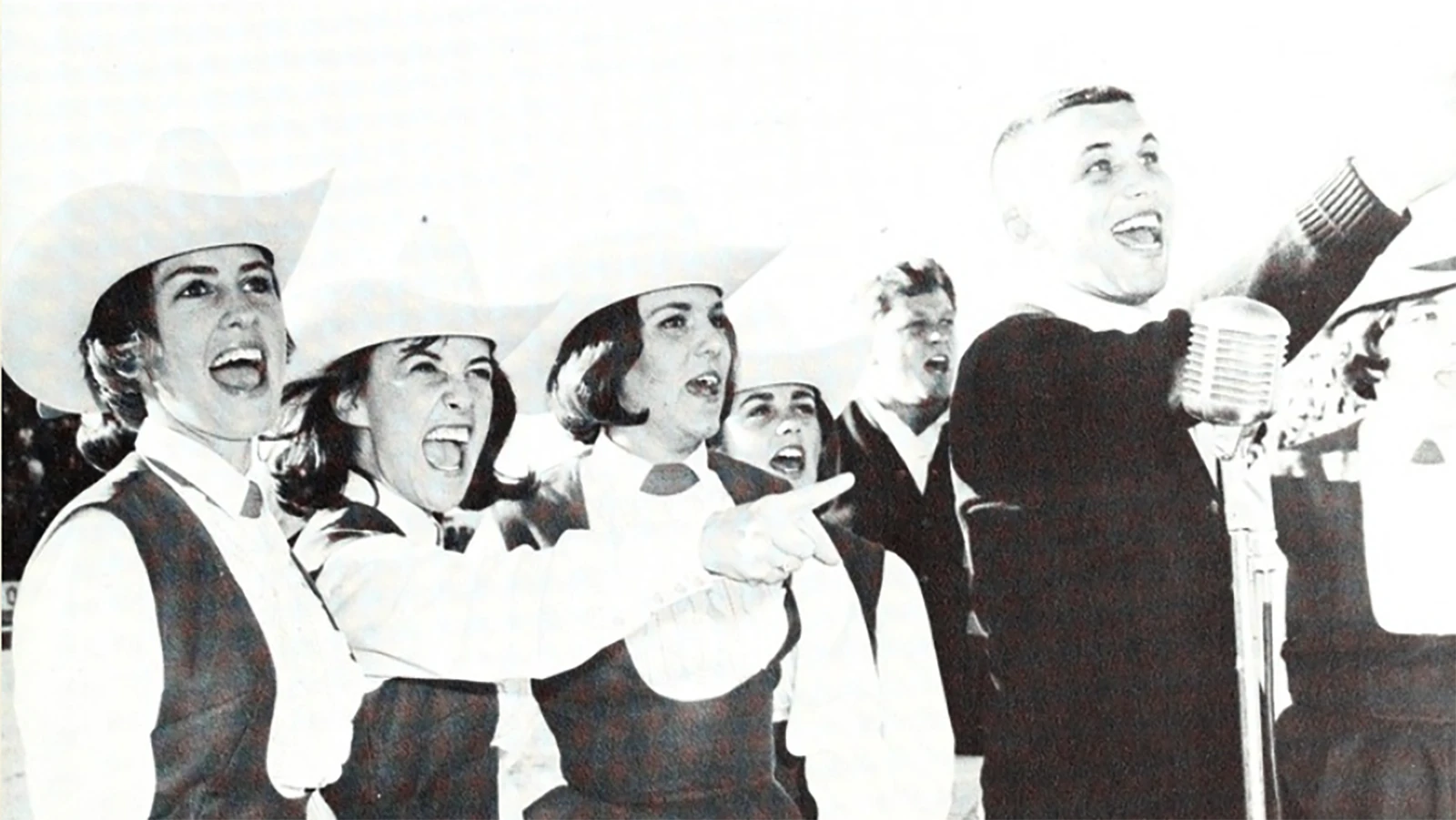 David Kolesky (back) and Nick Vuka (right) were recruited as male cheerleaders, known as "yell kings," to lead cheers, fight songs and chants.