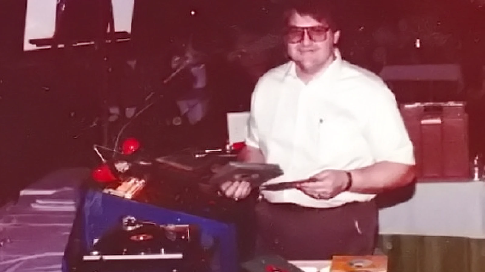 Dave Nutter as “Big John Leader” spinning records for a party in 1982.