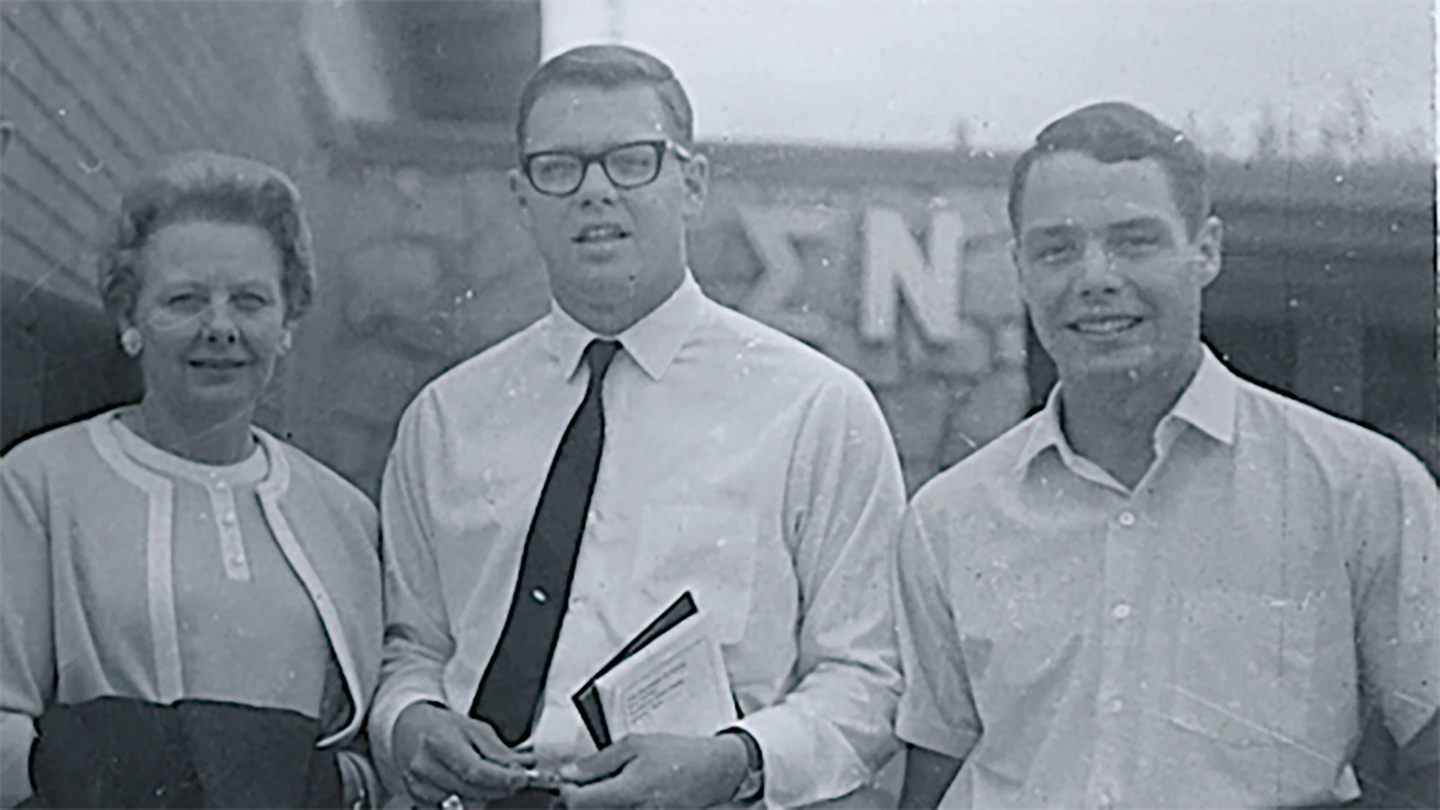 David Reetz, center, with his mom and brother outside the Sigma Neo fraternity house at this graduation.