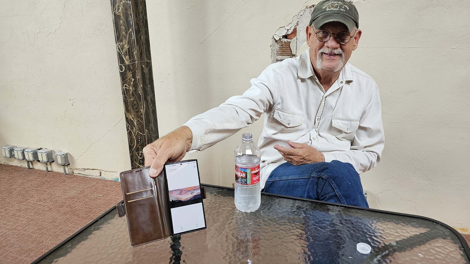 Dave Stewart shows a photo of a Montana sunrise that inspired a new song called "It's Another Missing You Montana Morning" with his friend Mark "Brink" Brinkman.