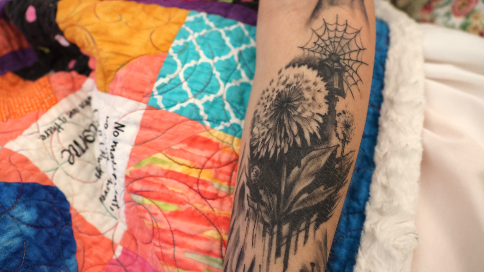 A dandelion flower in its seed stage that Deanna Cotten calls the “wish flower” is a central part of her tattoos that represent revelations she has received through therapy.