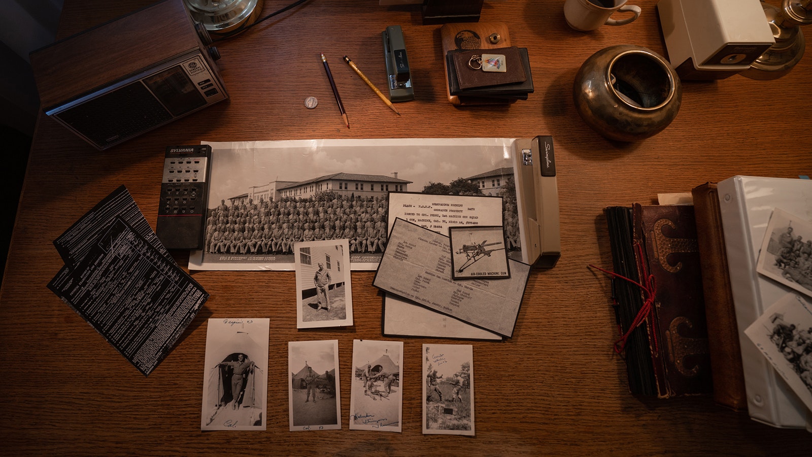 Sergeant Silvio Pedri of the 95th Infantry Division was taken prisoner in November 1944 nears Metz, France. He saved photos and documents from his time during the war in his office.