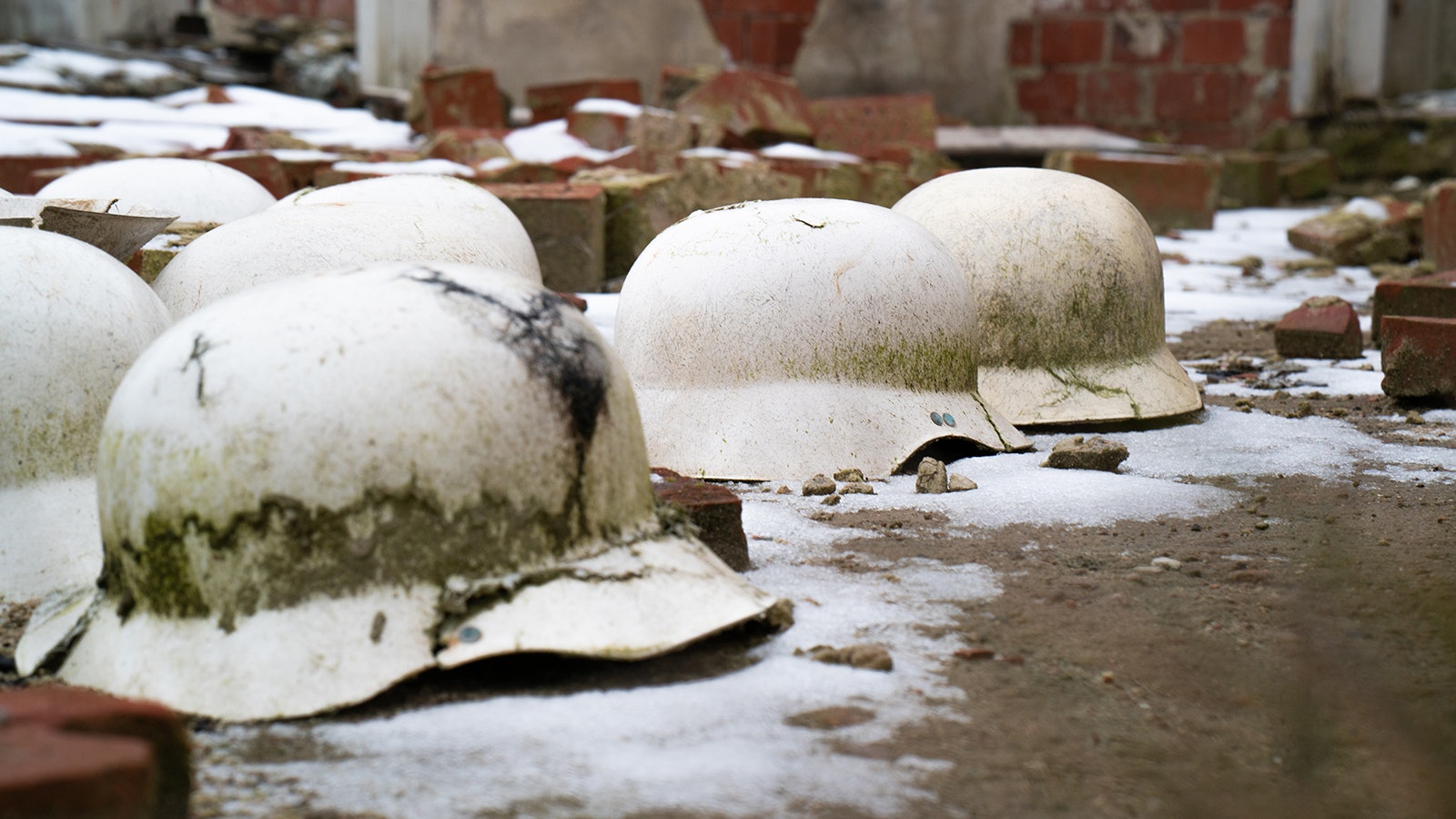 Helmets that were left behind at Stalag X-B, a World War II German prisoner of war camp located near Sanbostel.