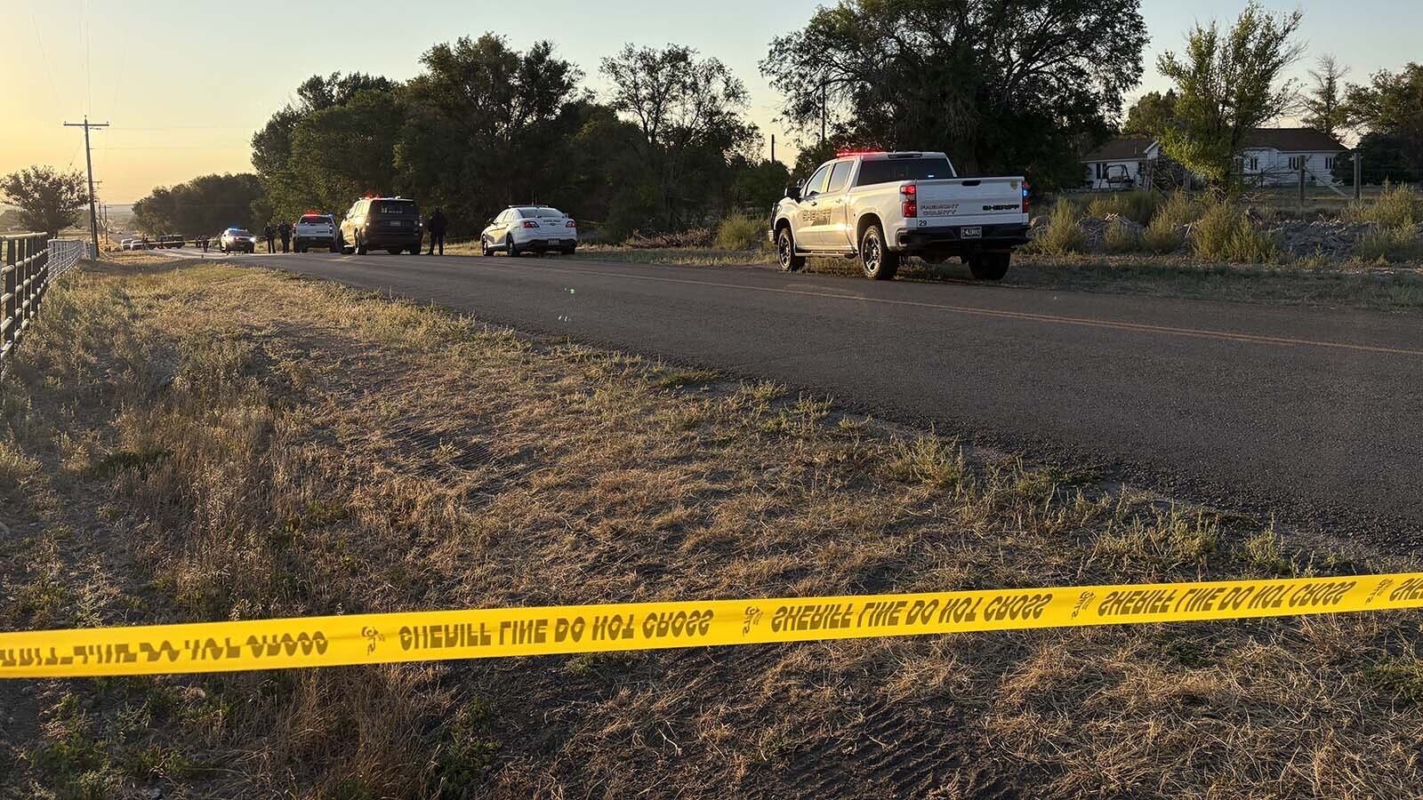 Fremont County Sheriff's deputies taped off a quarter-mile stretch of Honor Farm Road early Saturday for an hourslong death investigation, as a body lay on the south side of the road.