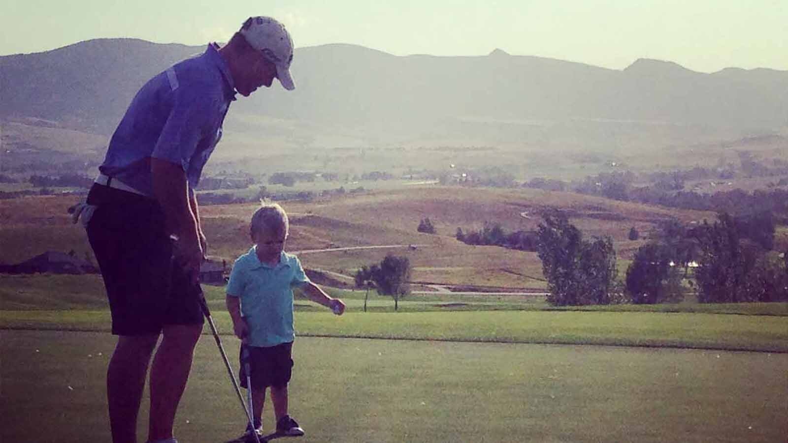 Declan Jacobson, 2, plays golf with his dad Arik in 2013.