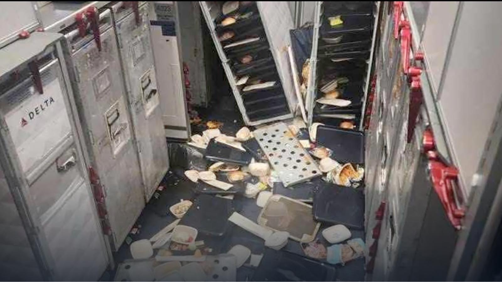 Meal trays and beverage carts on Delta Flight 56.