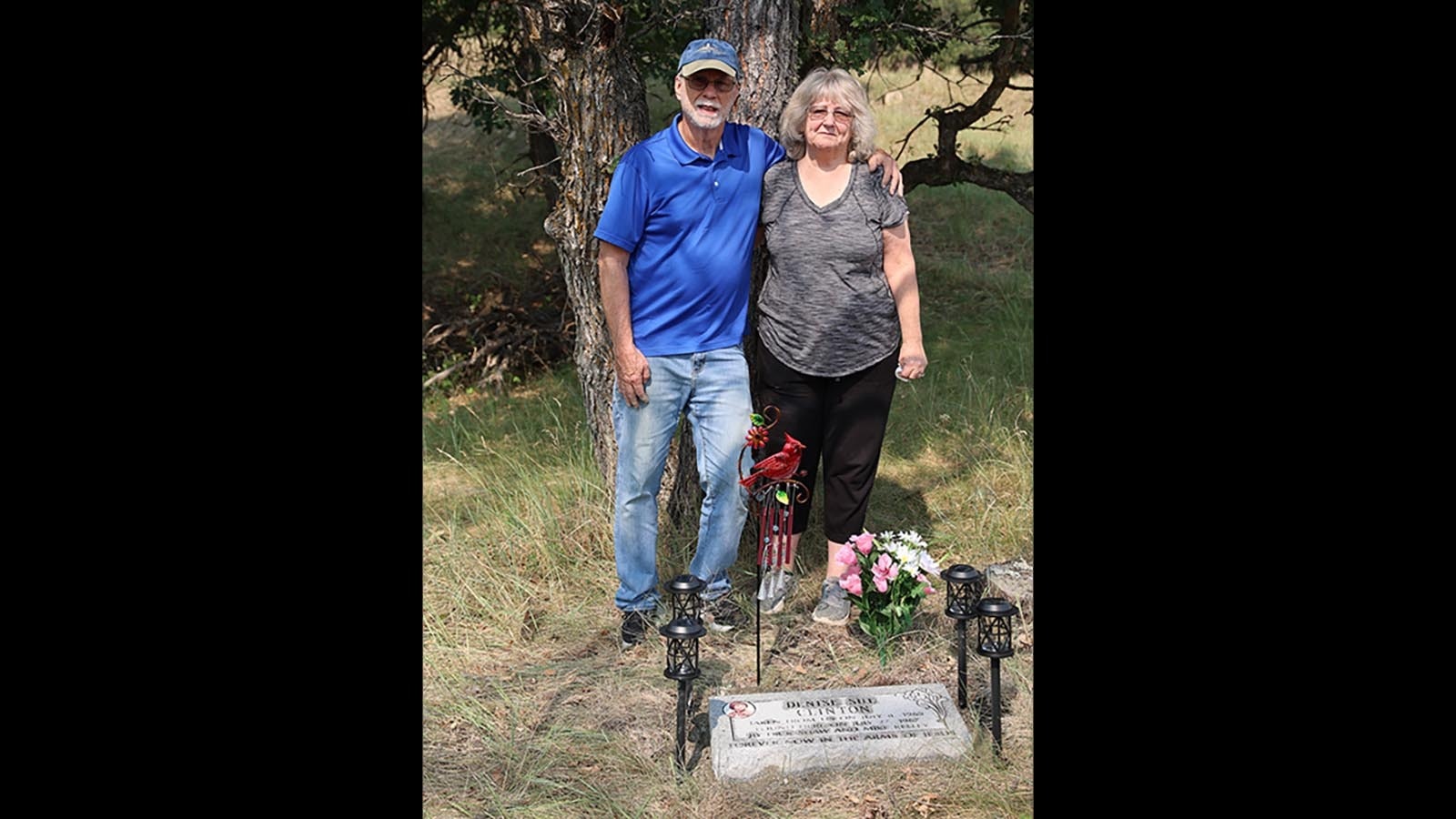 Facing her fears, Diana and John White stand before the gravestone they brought to Wyoming in honor of her sister.