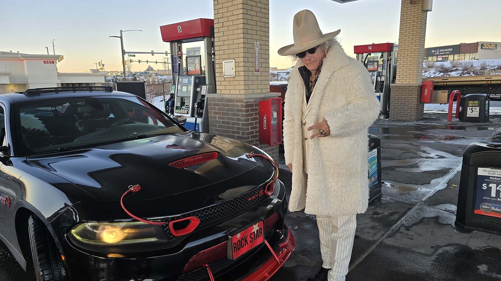 Prices for gas in and around Denver have been on a downward spiral, hitting into the low $1.70s Thursday for a gallon of regular unleaded. Meanwhile across the border in Wyoming 90 minutes away, the lowest without loyalty card discounts is $2.43 a gallon. Here, Billy Willis fills up in Parker, Colorado, at $1.99 a gallon.