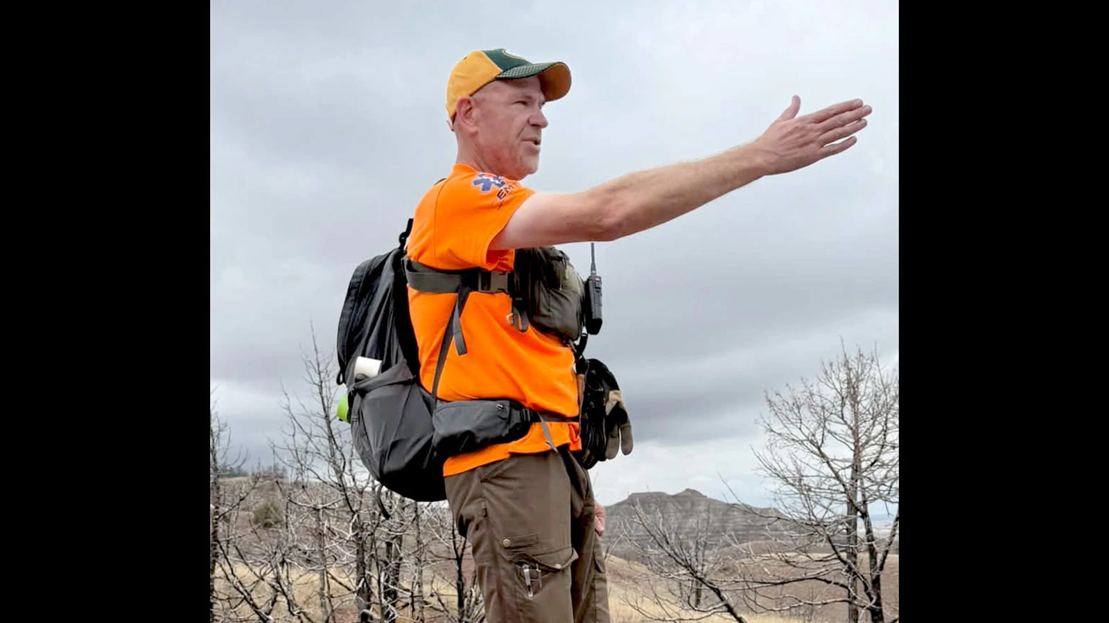 SAR volunteer and South Dakota law enforcement officer Chris Misselt directs volunteers to secure the area after remains were discovered.