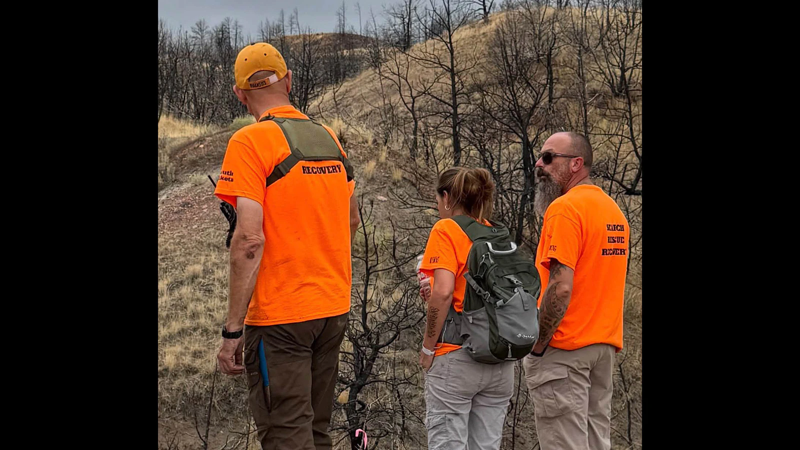 Bobby and Stacy Koester discuss search logistics with Chris Misselt Saturday in the search for Derek Schaff.