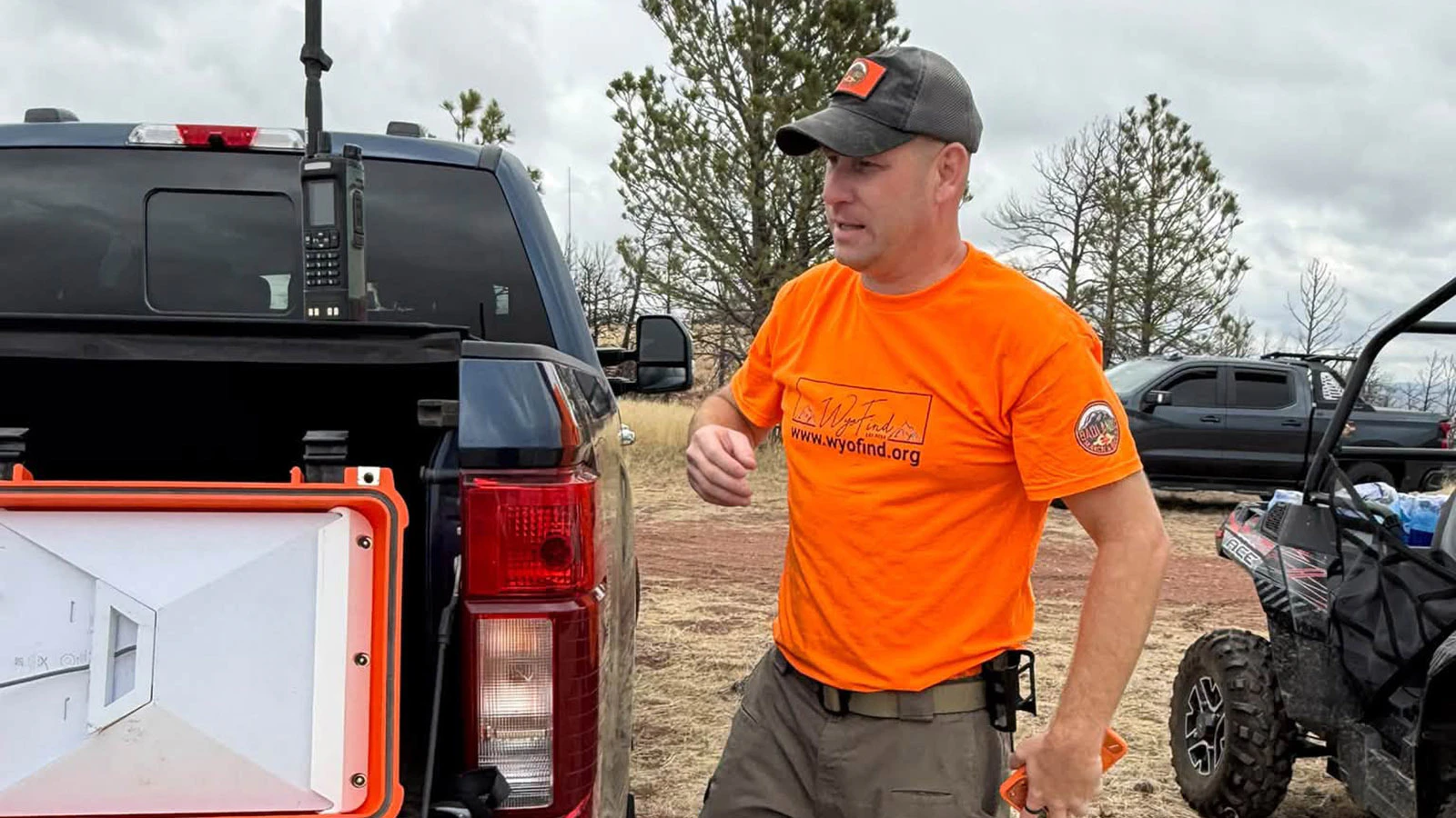 Travis Bateman of Badland Search and Rescue answers the radio call that Derek Schaff's remains had been found.