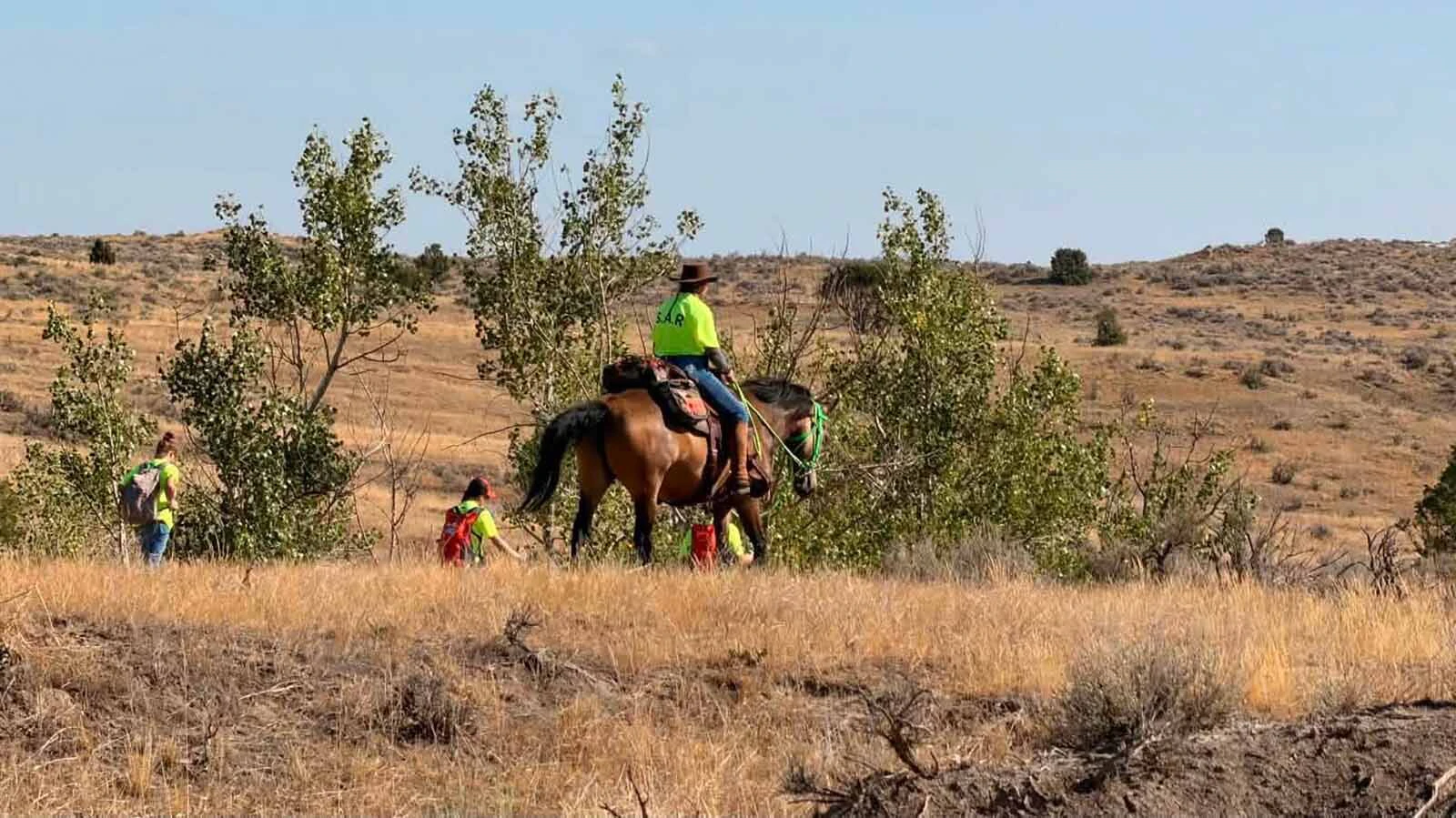 Search and rescue volunteers scour Weston Hills Recreational Area for any sign of missing Gillette man, Derek Schaff. 