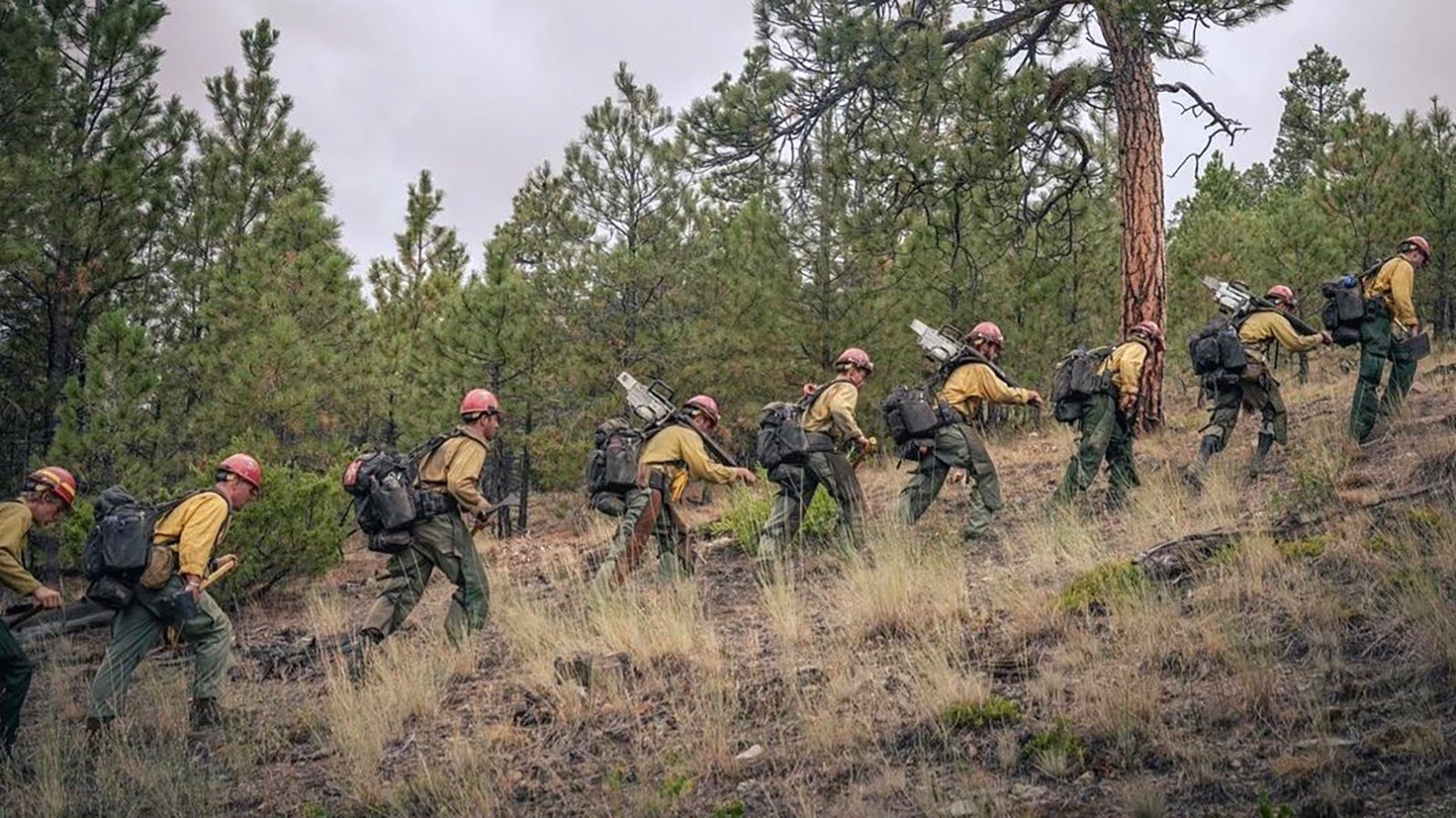 Devil's Canyon crew hikes up a hill while fighting the South Fork Lyons Fire in Montana.