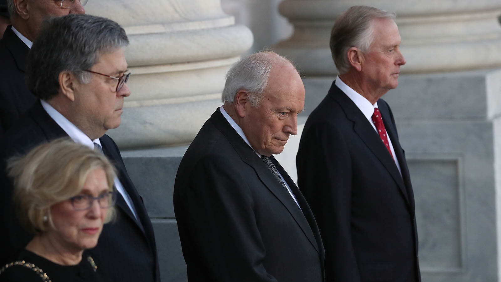 Former U.S. Vice President Dick Cheney, second from right, and former U.S. Vice President Dan Quayle await the arrival of the procession carrying the casket of former U.S. President George H.W. Bush at the U.S. Capitol for his funeral Dec. 3, 2018, in Washington, D.C.