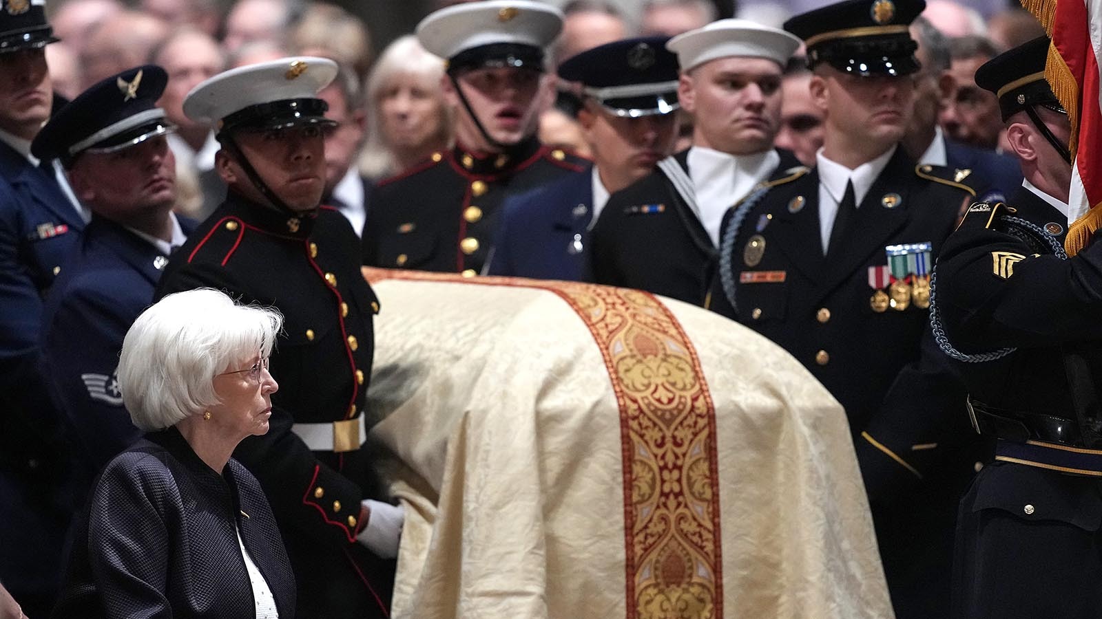 Lynne Cheney looks on as U.S. military body bearers carry the casket containing the remains of her husband, former U.S. Vice President Dick Cheney, at his funeral service at the National Cathedral on Nov. 20, 2025, in Washington, D.C.