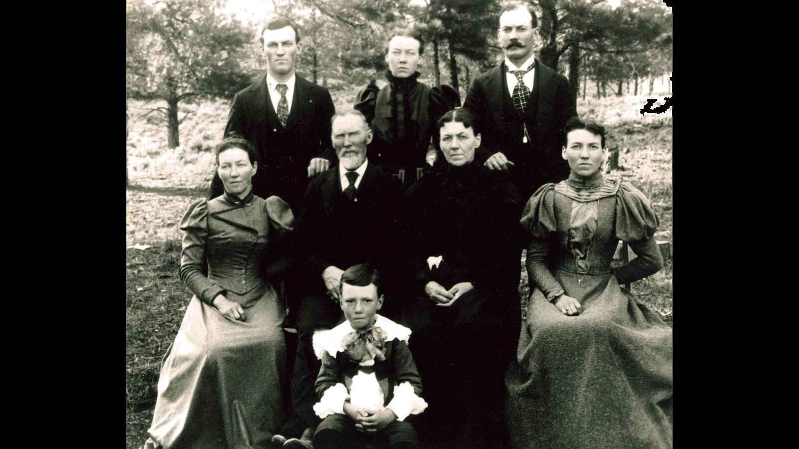 The Nelson family in 1896 at the home in Newcastle, Wyoming. Carl Nelson is in front, seated from left is Nancy Nelson, Alfred Milton Nelson, Mary Caroline Nelson, and Orpha May Dow Nelson. Standing is Dick Nelson, Laura Nelson, and Frank Nelson.