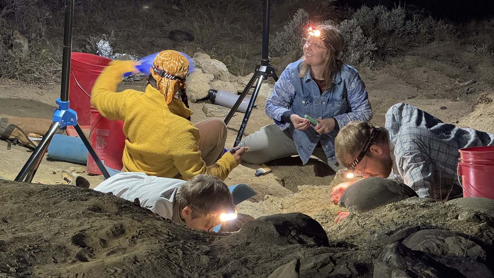 Dinosaur diggers work by lantern light at Triceratops Gulch near Glenrock. To maximize the on-site, down-and-dirty experience for participants, summer excavations extend into the evening, so the search for turtle shell, Triceratops ribs, and T.rex teeth can continue.