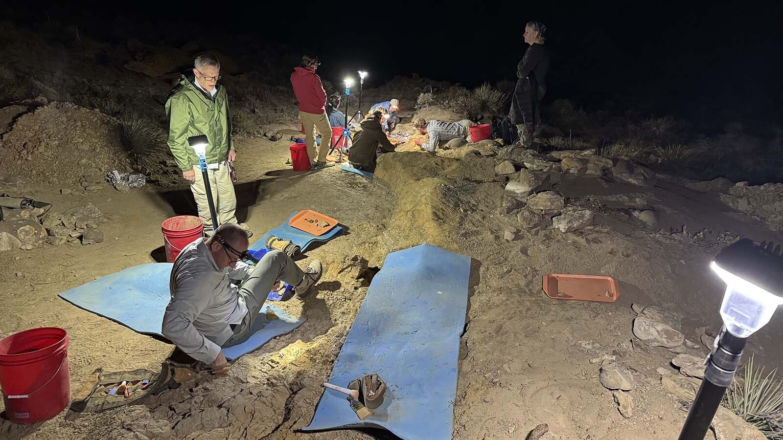 Dinosaur diggers work by lantern light at Triceratops Gulch near Glenrock. To maximize the on-site, down-and-dirty experience for participants, summer excavations extend into the evening, so the search for turtle shell, Triceratops ribs, and T.rex teeth can continue.