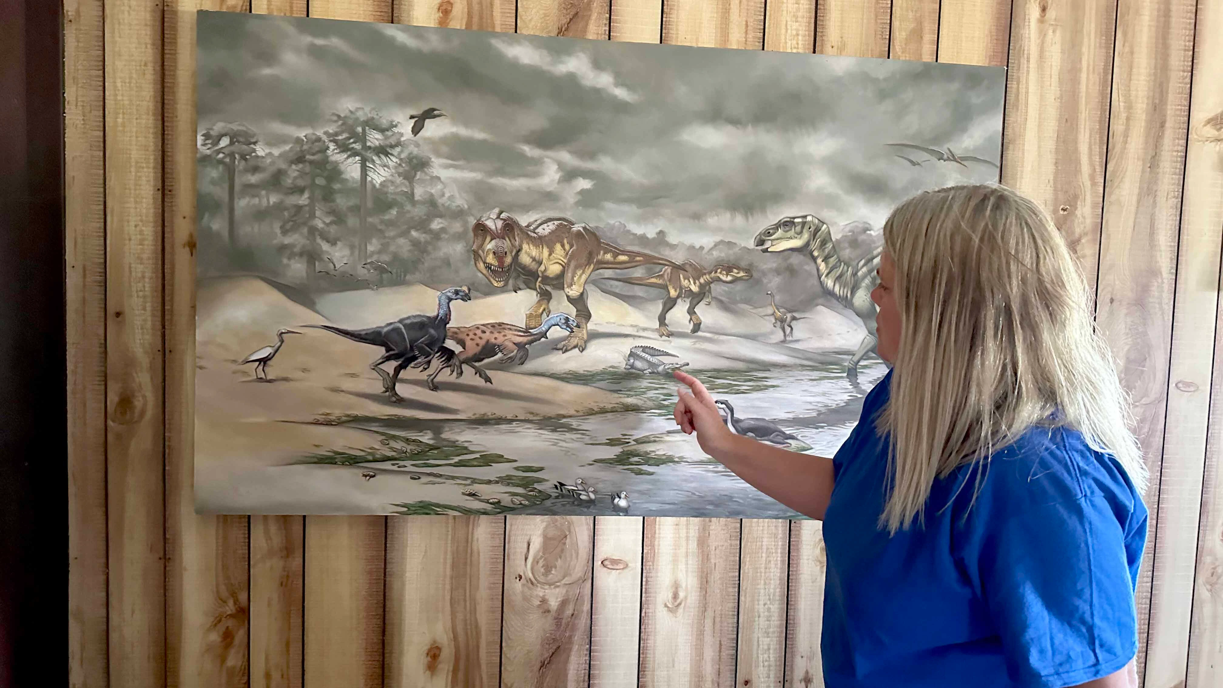 Kristen Stauffer on the one-of-a-kind Zerbst Trackway on the Zerbst "Paleo Park" Ranch near Newcastle. Stauffer has been taking tours to the track site, found by her father Leonard, for years. That's why she was "shell-shocked" that someone trespassed on and damaged a rare hadrosaur footprint.