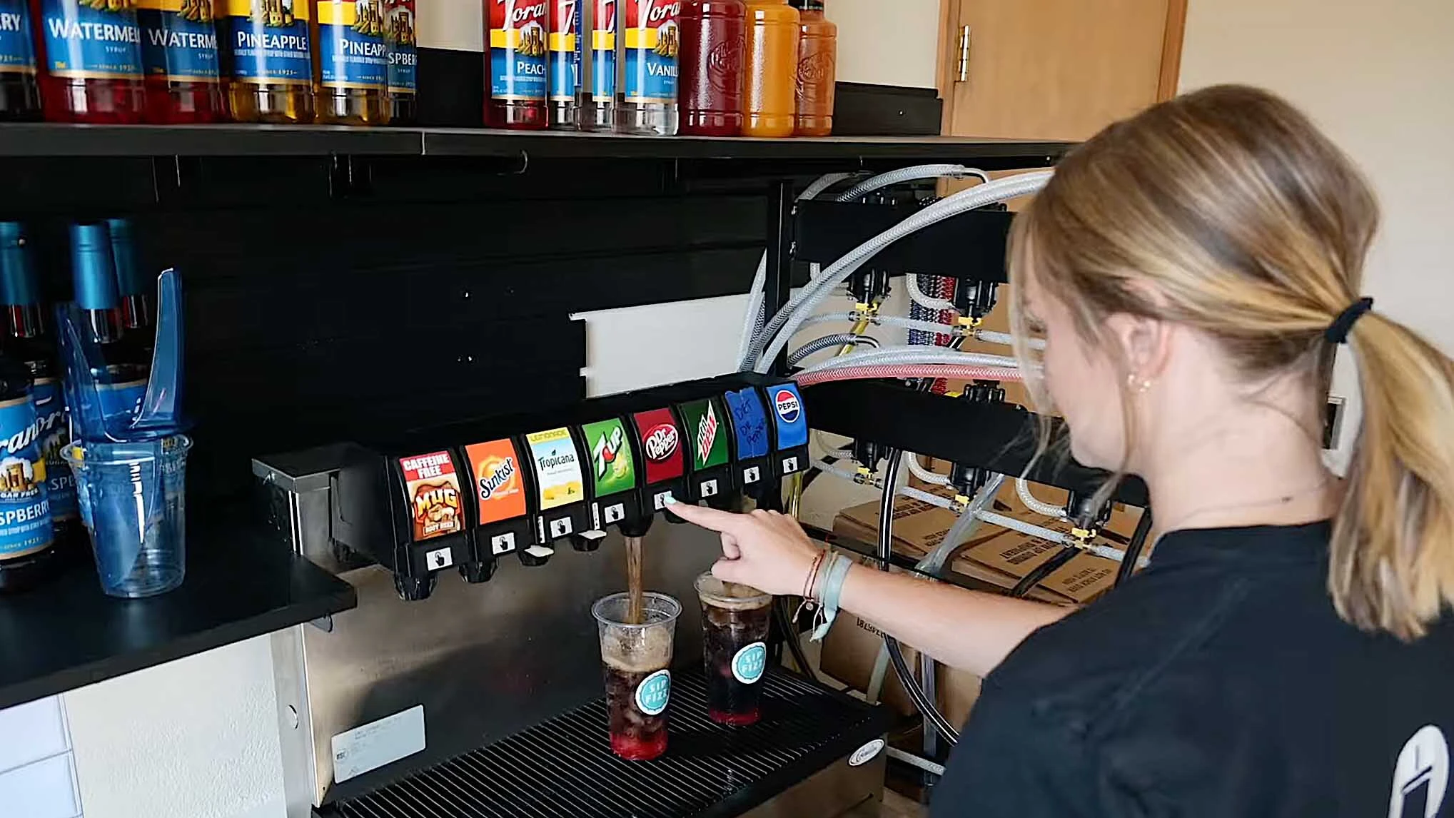 Kinley Boulter prepares a drink at her Sip Fizz Soda shop in Pinedale.