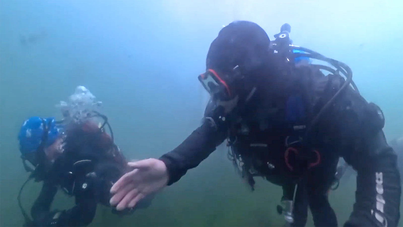 Divers explore the Tibble Fork Reservoir in Utah.