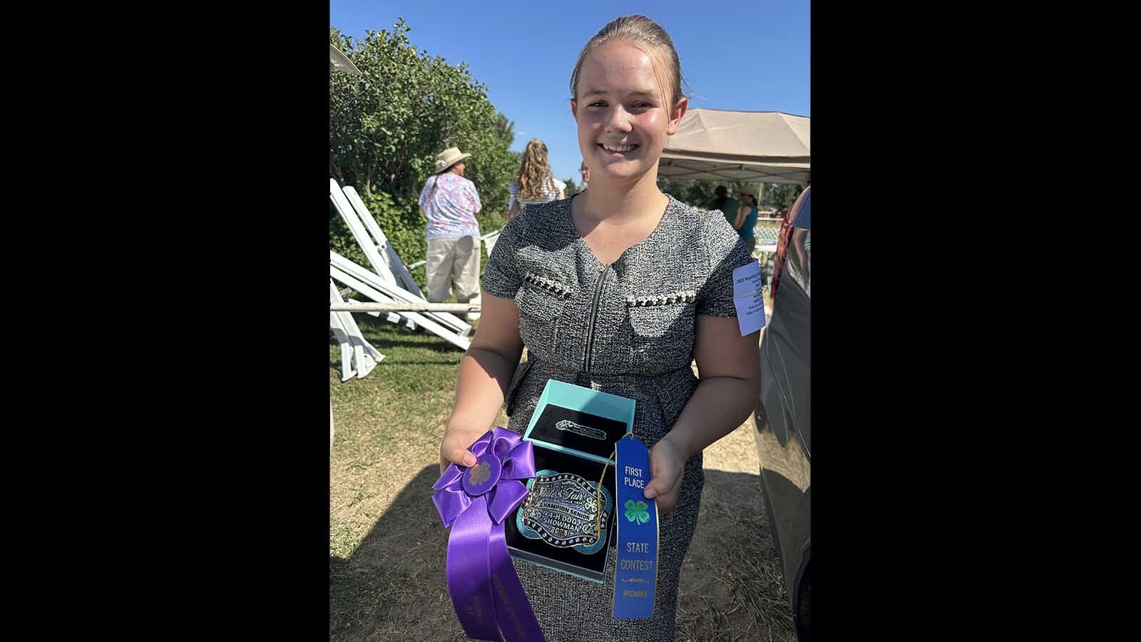 Amelia Weber helped out her big sister by holding on to Ruby who competed at the Wyoming State Fair in Douglas during the 4-H Dog Show and Showmanship.