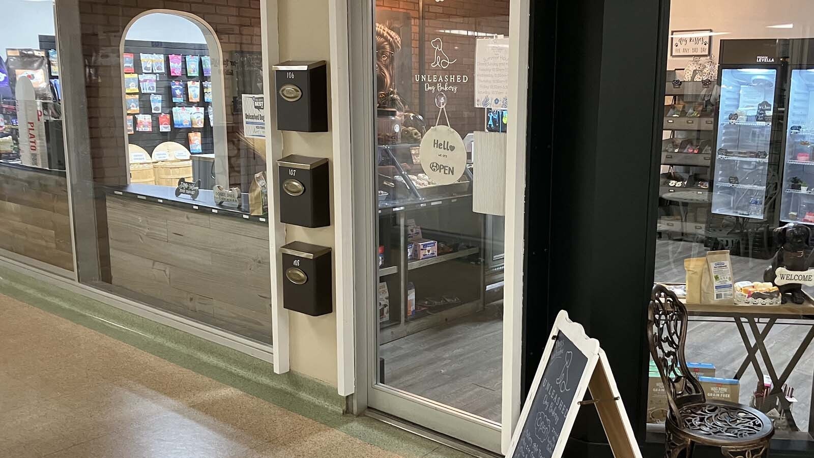 The door to the Unleashed Dog Bakery inside the Wolcott Galleria gets regularly banged on by a German Shepherd customer.