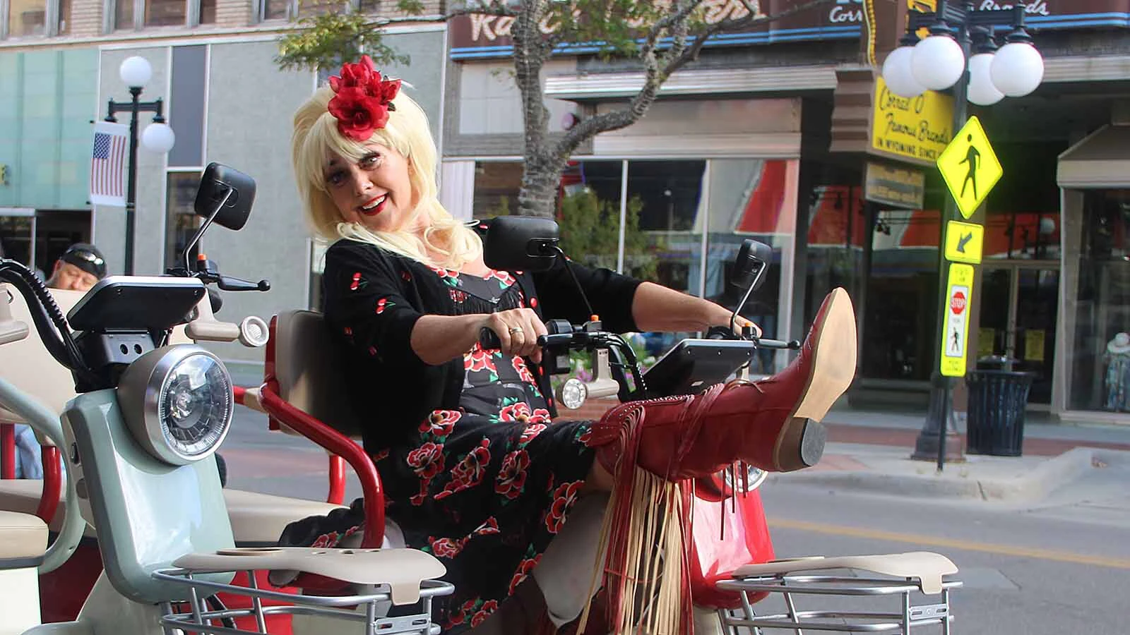 Buffie LaRocca sports a scooter for the Dolly March that happened in downtown Casper on Friday.