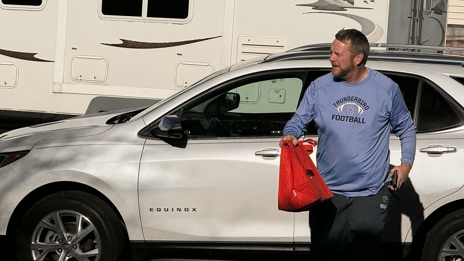 Mike Aumiller delivers a DoorDash order from Arby's to an address in south Cheyenne on Sunday. Aumiller said his wife delivers DoorDash during the week, and he does it on weekends to make some extra money.