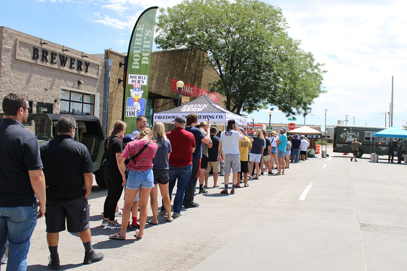 A long line of people wait for buffalo wings as Weitzel's Wings begins its world-record attempt at Freedom's Edge Brewing Co. in downtown Cheyenne on Friday afternoon.