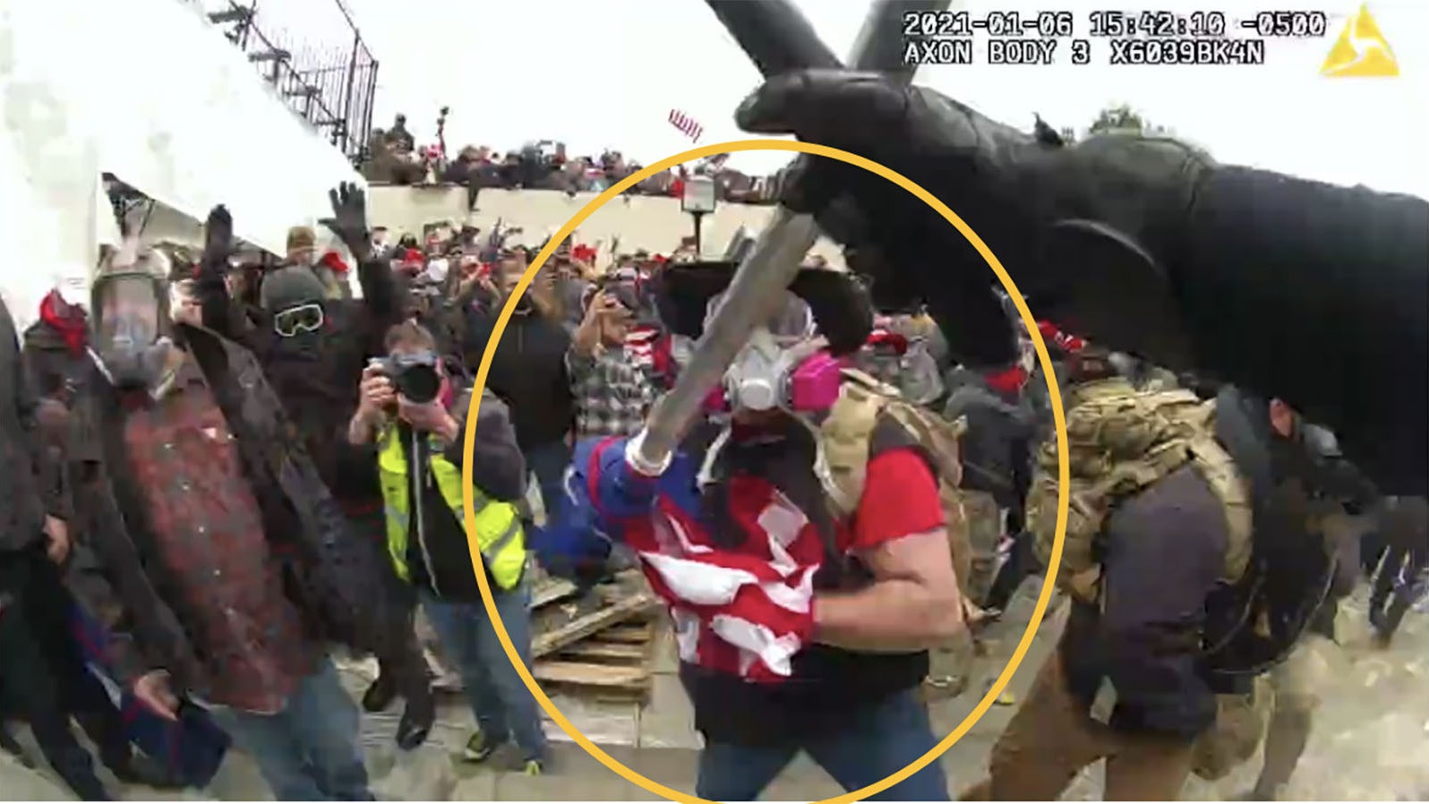 A photo taken from U.S. Capitol Police body cam video shows a man, identified by the FBI as Douglas Harrington of Wyoming, assaulting an officer with a flagpole.