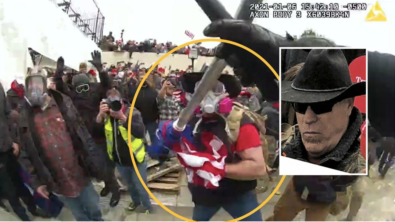 A photo taken from U.S. Capitol Police body cam video shows a man, identified by the FBI as Douglas Harrington of Wyoming, assaulting an officer with a flagpole.