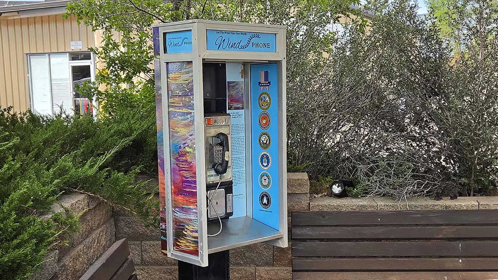 The old phone in a booth in Douglas has no dial tone and no one on the other end. Still, people pick up the receiver and reach out on the "Wind Phone."