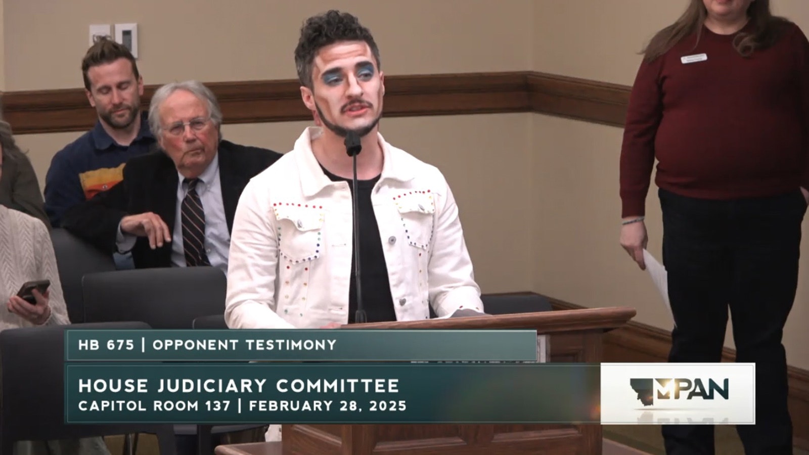 Valan Anthos, an attorney and "drag king," testifies against a bill that would allow parents to sue if their children are exposd to "hyper sexualized" shows. Anthos appeared in make-up and said his drag act was inspured by the boy band 'NSYNC.