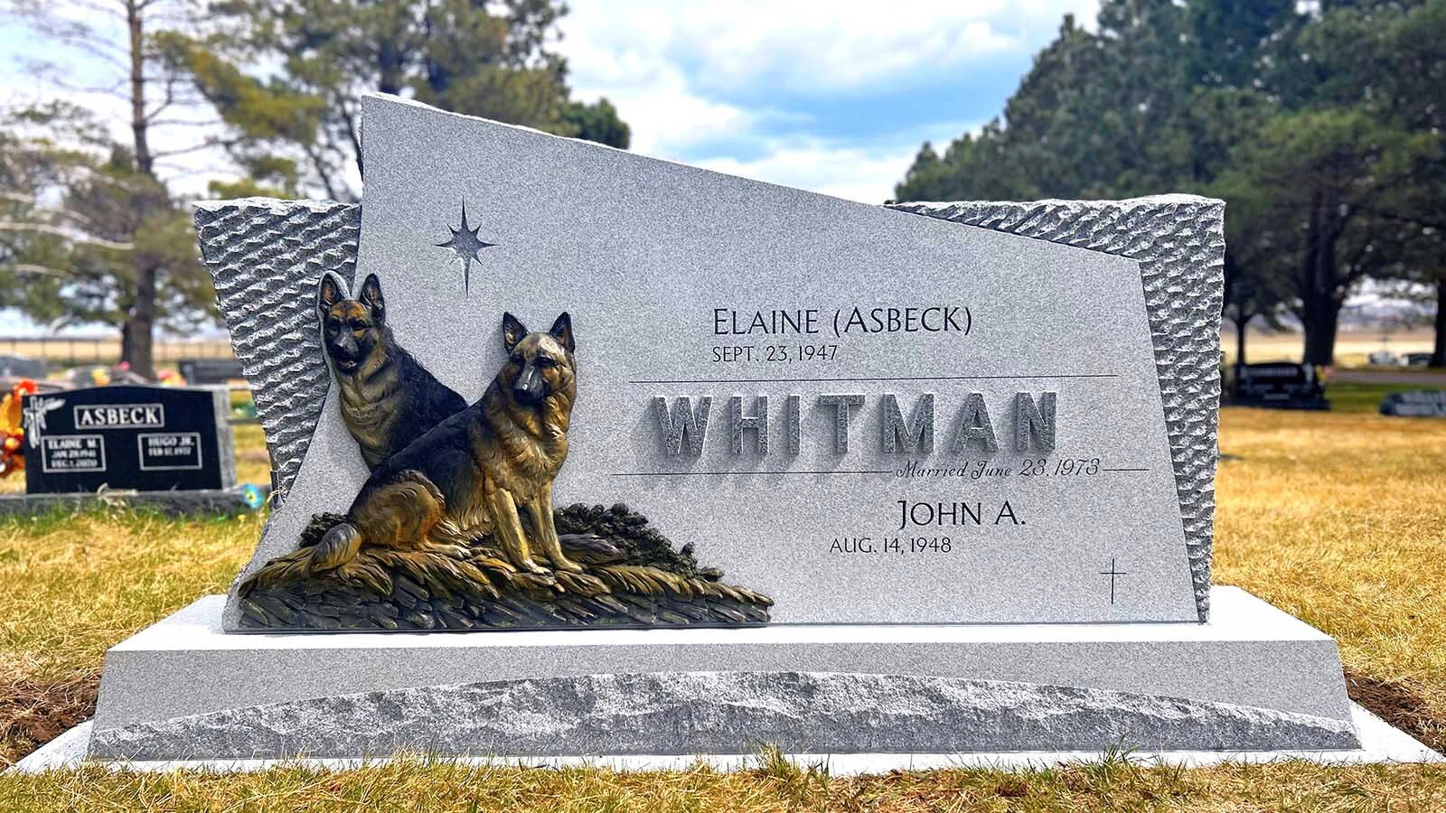 Drew Bott listens to people so that their memorial art will be unique to them. This memorial features dogs that are nearly life size and the stone is about eight feet long. 
