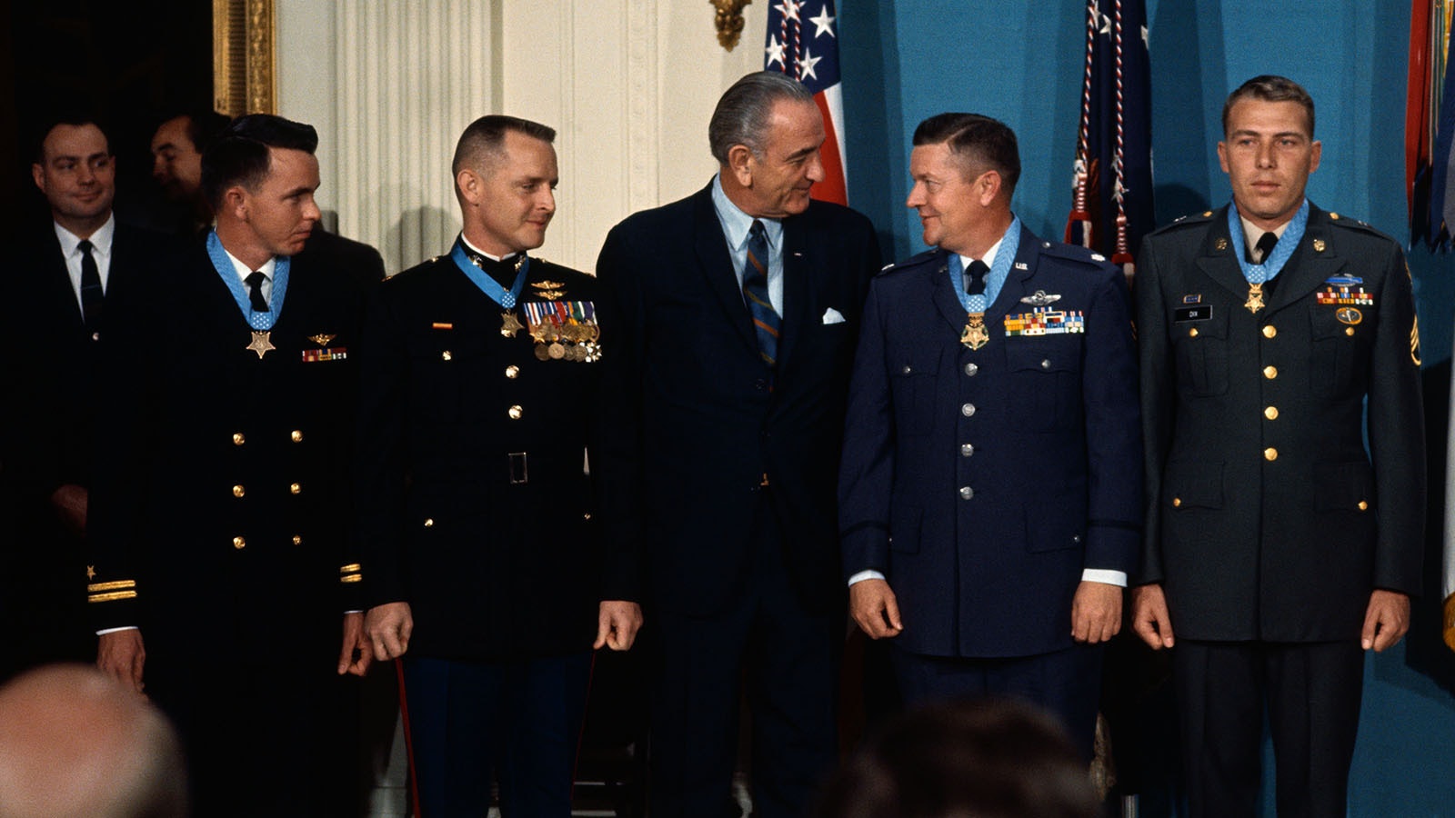 President Johnson poses with four U.S. servicemen, two of them from the same small town in Georgia, to whom he presented the Medal of Honor for heroism in Vietnam. From left, Navy Lt. Clyde E. Lassen, Ft. Myers, Fla.; Marine Maj. Stephen W. Pless, Newman, Ga.; President Johnson; Air Force Lt. Col. Joe M. Jackson, also from Newman, Ga.; and Army Staff Sgt. Drew D. Dix, Pueblo, Colorado.