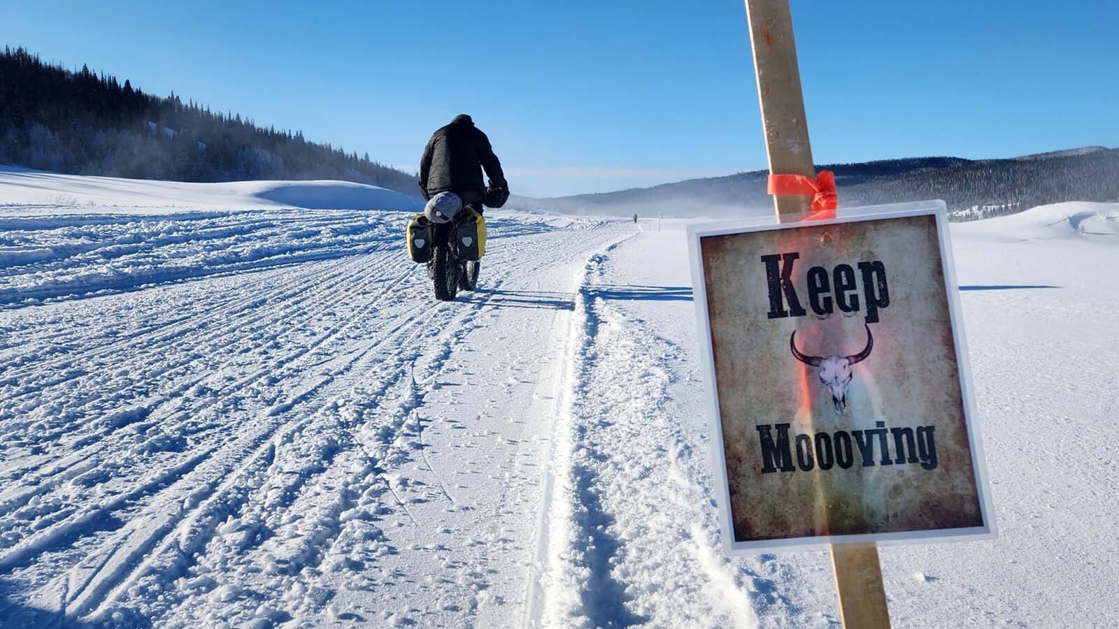 Riders travel the final 3 miles of the 2022 race when the temperature was about minus 20.
