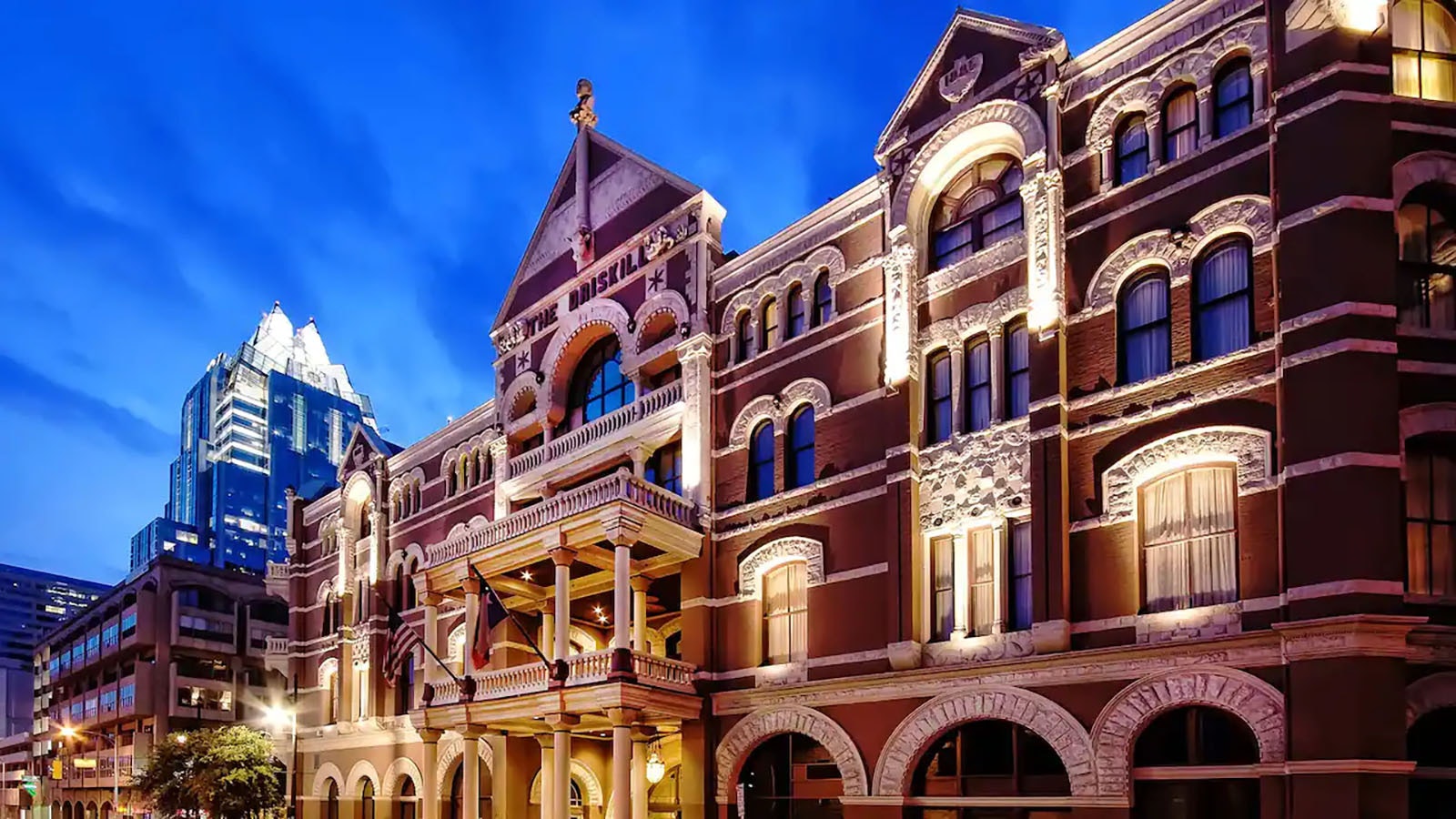 The facade of The Driskill at sunset.