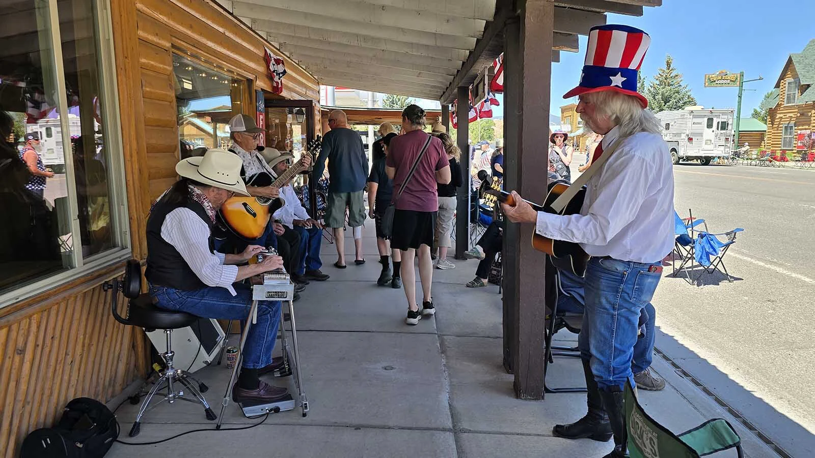 A patriotically dressed musical group serenaded people in Dubois walking up and down the Main Street while waiting for the parade to begin.
