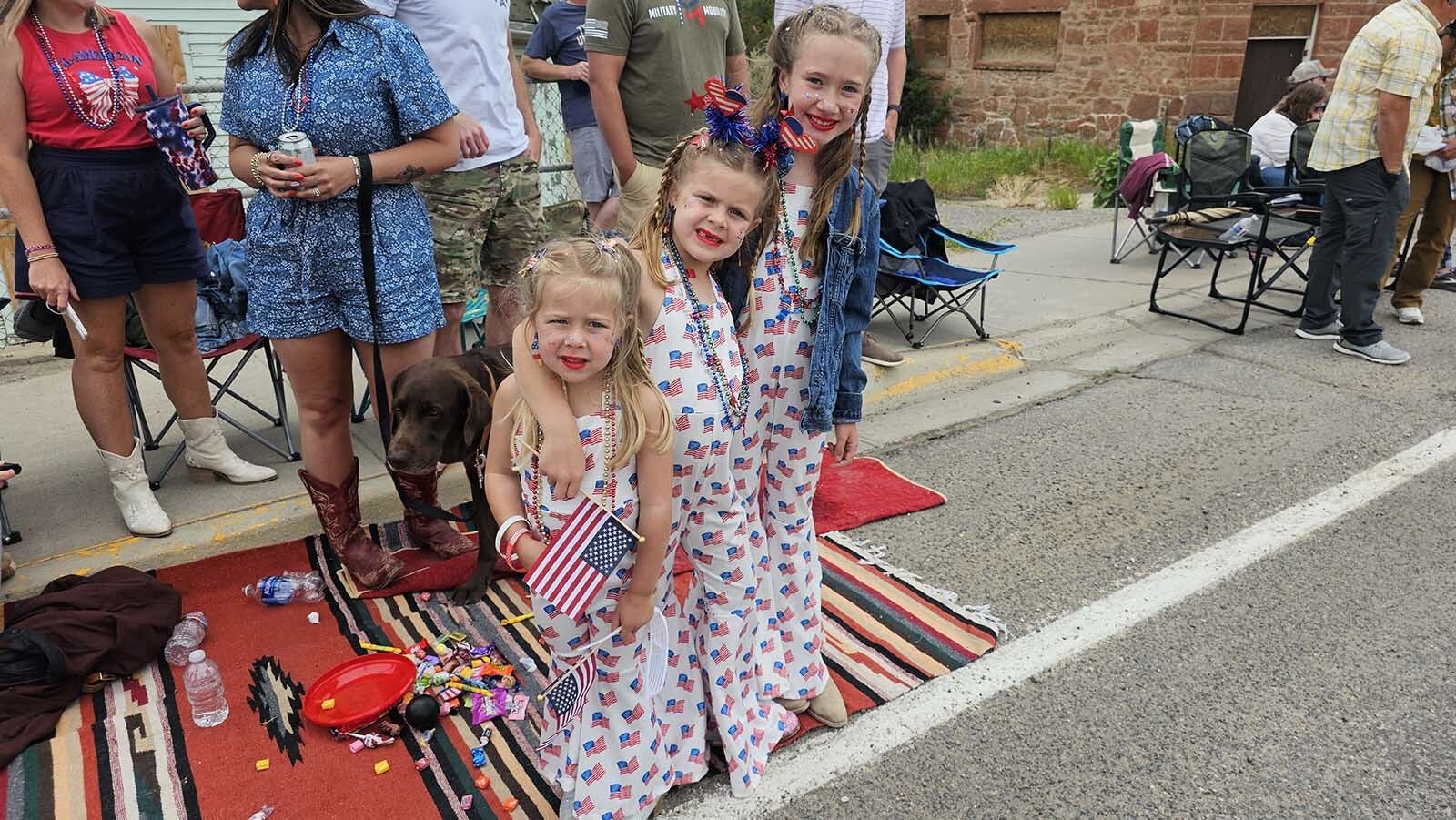 From left, Ella and Amelia Hoehn with Reese Harris, were decked out in Fourth of July rompers for the Dubois parade.