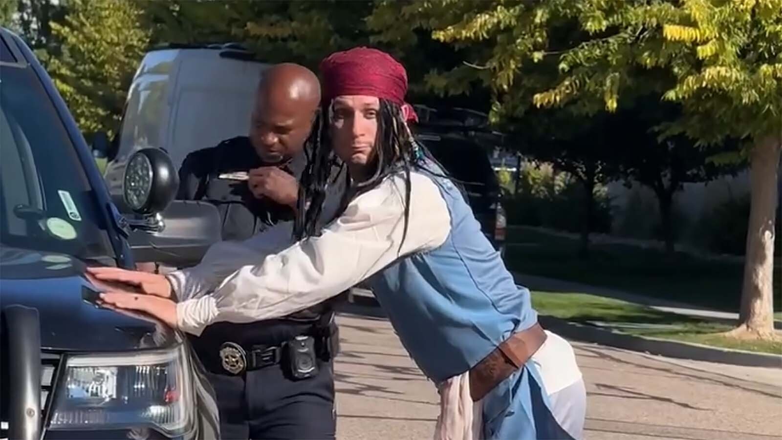 Dude Dad, aka Taylor Calmus, stopped by a police officer after driving a pirate ship on city streets.