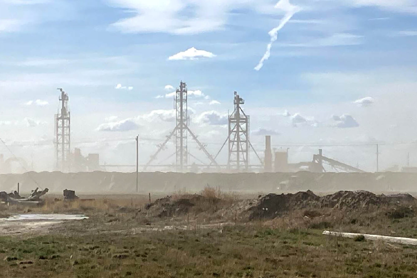 Clouds of dust are visible in and around Yoder, Wyoming, much of the day from a sand processing plant.