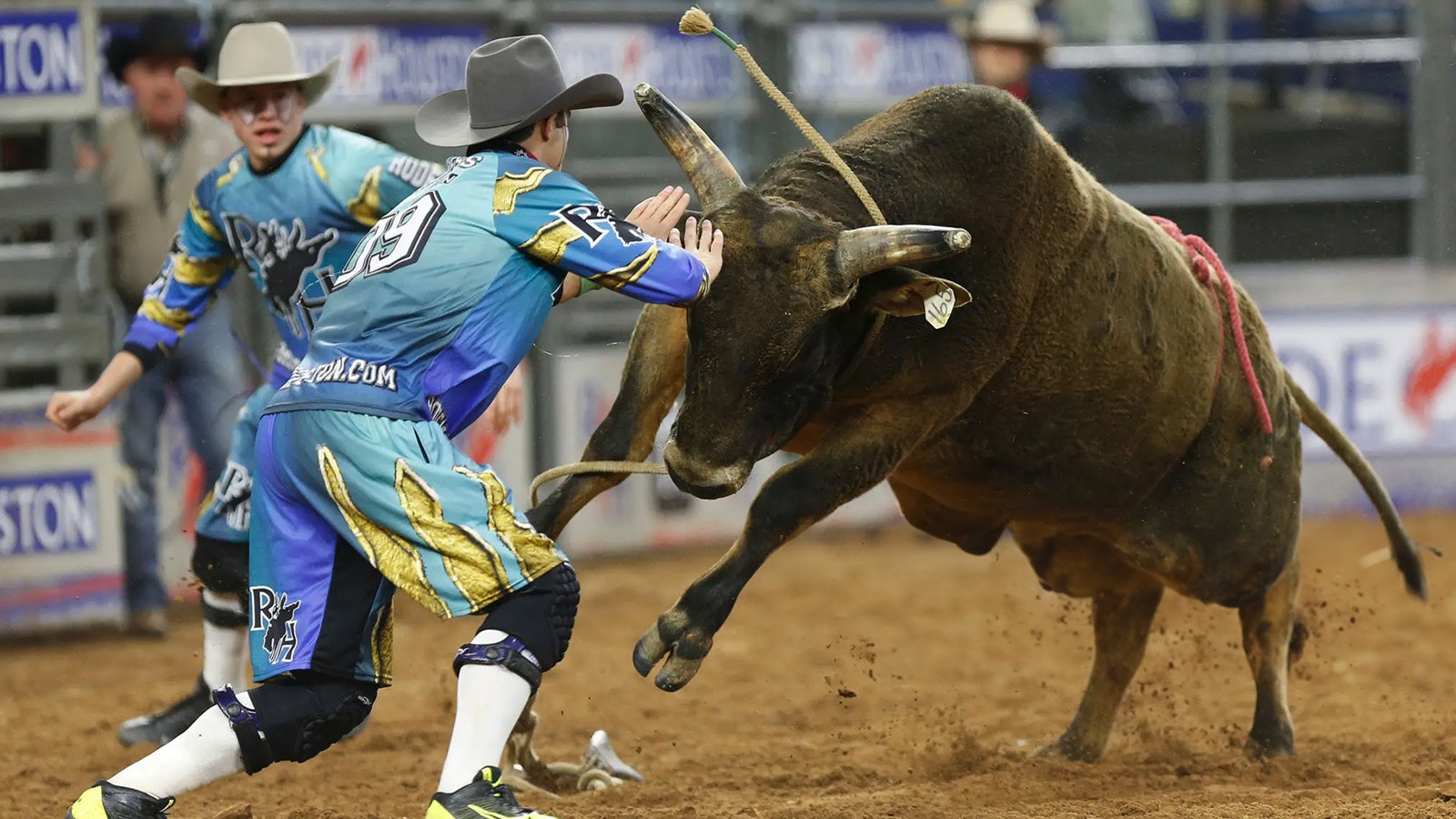 Bullfighter Dusty Tuckness tries to stop Hustle & Flow during the bull riding competition during the Houston Livestock Show and Rodeo at NRG Park on March 7, 2015, in Houston.
