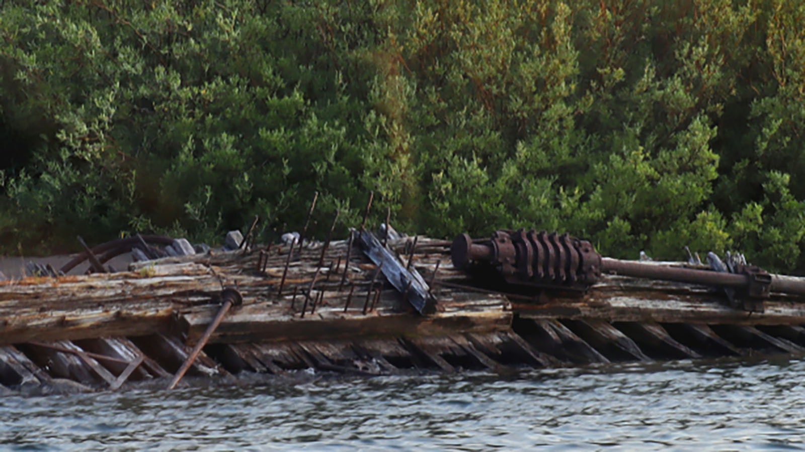 The wreck of the E.C. Waters has been slowly rotting, rusting and deteriorating on the shore of Stevensoon Island on Yellowstone Lake.