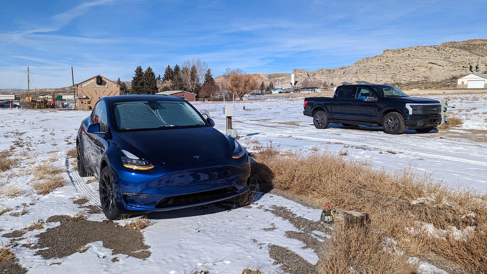 Garrick Johnson's Tesla charges next to a Ford Lightning pickup at an RV park near Rock Springs.